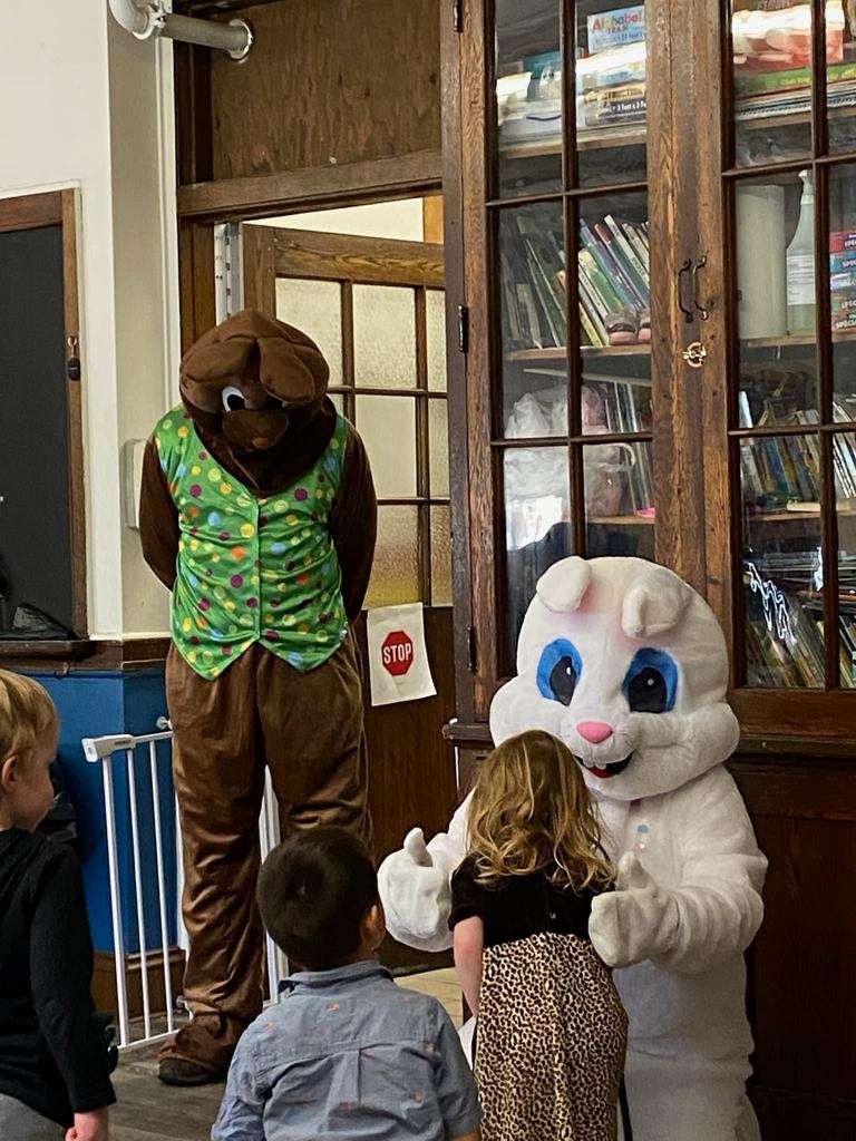 two easter bunnies visiting kids
