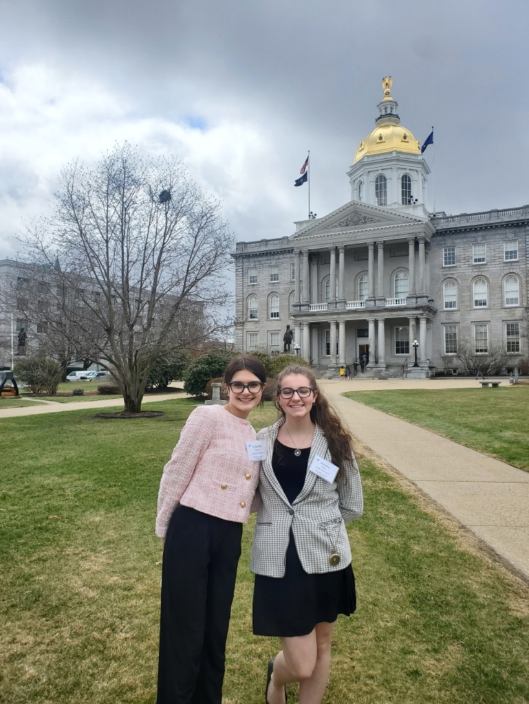 Two students in front of the State House in Concord