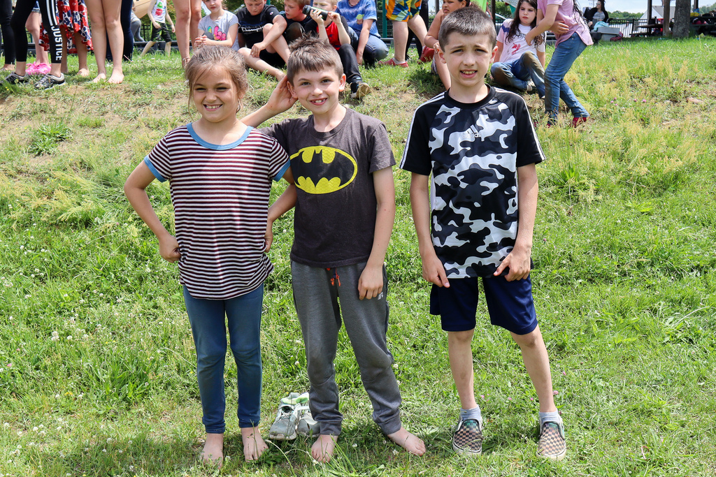 students standing in field for games